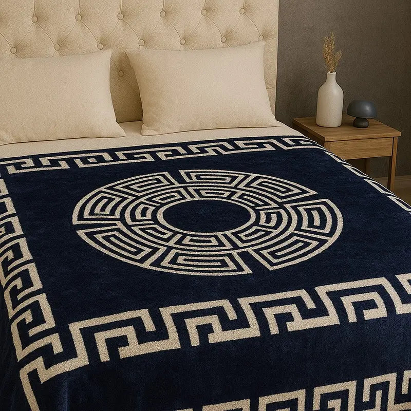 The Super Soft Thermal Warm Cosy Blanket folded neatly, available in elegant colors that complement any home décor style.