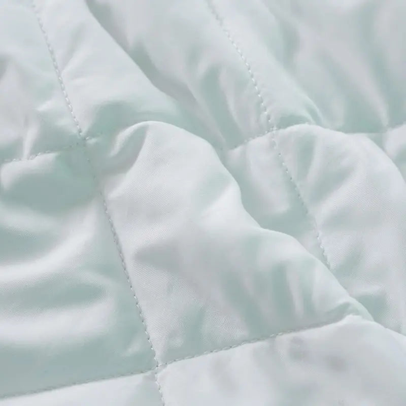 Luxury Quilted Mattress Protector Extra Deep Fitted Breathable Mattress on a bed, demonstrating the perfect fit with an extra deep elasticated fitted skirt for mattresses up to 18 inches thick.