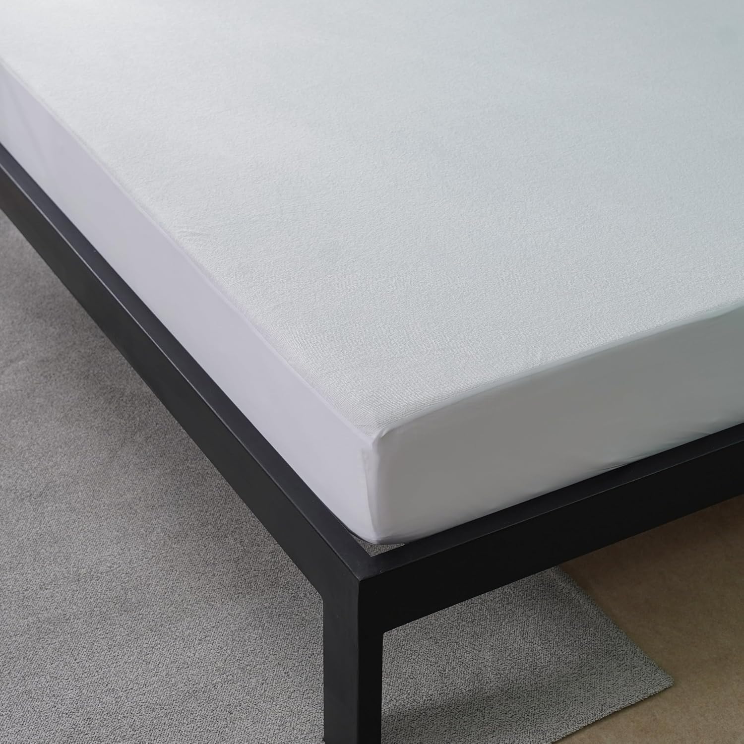 Close-up of the IMFAA 100% Waterproof Mattress Protector with a focus on its waterproof barrier technology that protects against spills and stains.