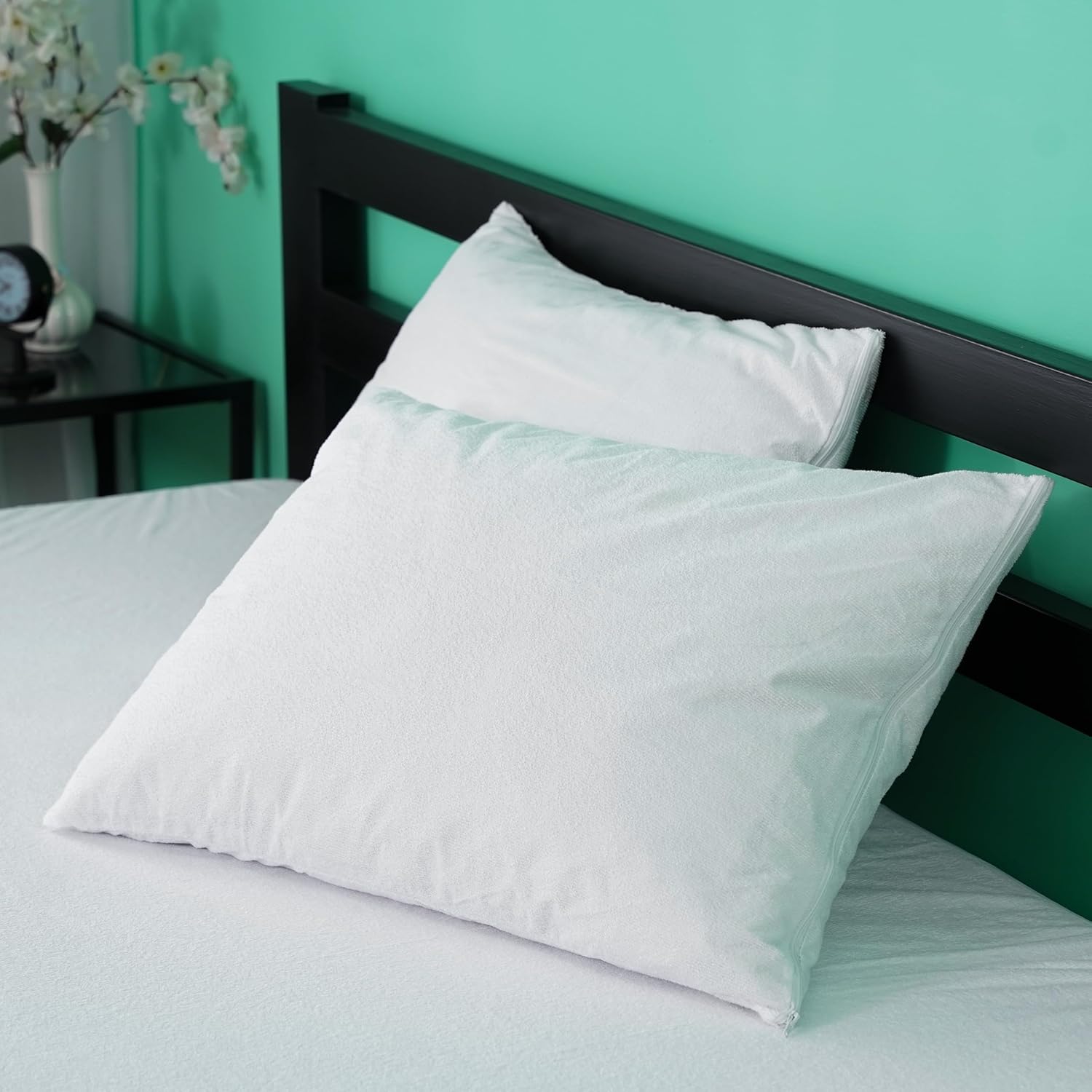 IMFAA 100% Waterproof Mattress Protector displayed on a bed, showcasing its sleek design and soft fabric for ultimate comfort and protection.