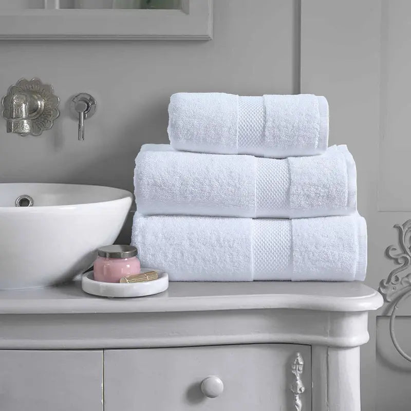 LUXURY 3-PIECE TOWEL SET featuring a Bath Towel on a bathroom rack, emphasizing its generous size and elegant design suitable for any decor.