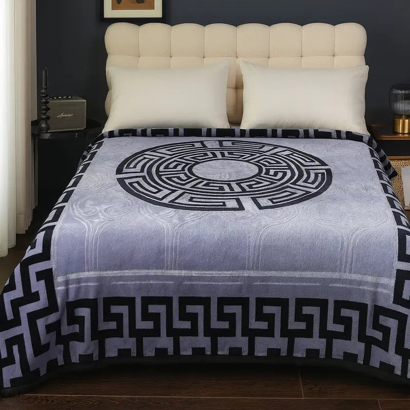 Super Soft Thermal Warm Cosy Blanket folded neatly with a book and a cup of tea, illustrating its perfect use for relaxation.