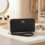 Coach Signature Black Embossed Accordion Zip Around Wallet with Wrist Strap