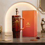 Karol G x Stanley Quencher H2.0 FlowState Insulated Stainless Steel 40oz Tumbler with Straw and Gift Box, Orange Floral