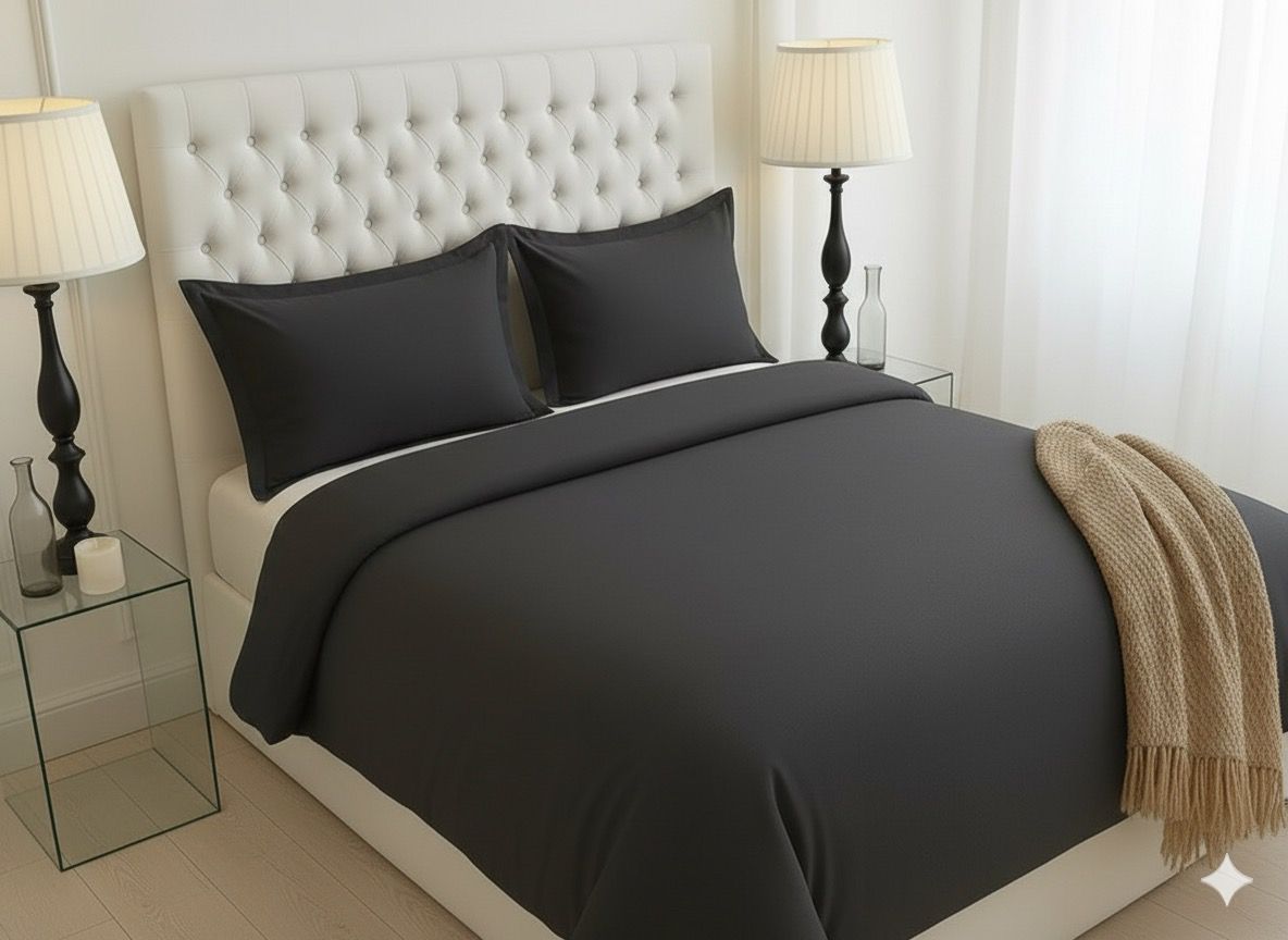 Luxury 4-Piece Black Microfiber Bedding Set displayed on a stylish bed, illustrating modern elegance and comfort.